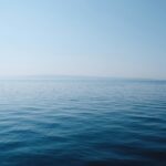 Calm, clear tropical sea under a blue sky during Tioman's dive season