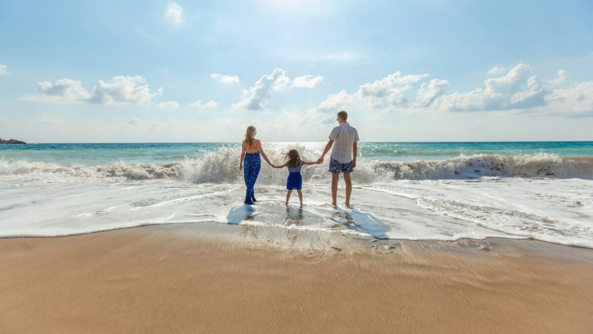 Family enjoying the beach together on a Tioman Island holiday