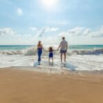 Family enjoying the beach together on a Tioman Island holiday