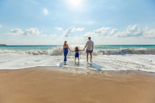 Family enjoying the beach together on a Tioman Island holiday