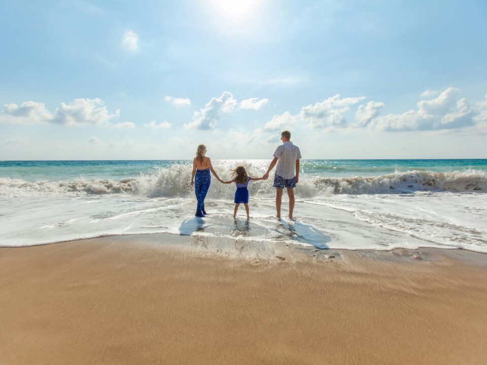 Family enjoying the beach together on a Tioman Island holiday