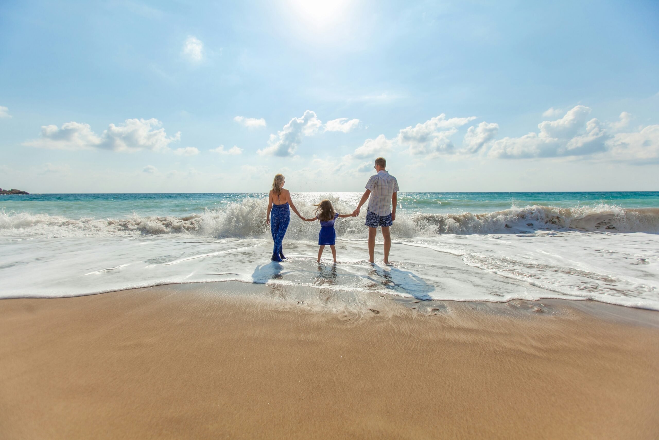 Family enjoying the beach together on a Tioman Island holiday