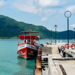 Ferry approaching a tropical island jetty like Kampung Genting on Tioman
