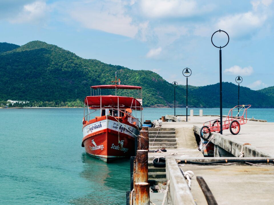 Ferry approaching a tropical island jetty like Kampung Genting on Tioman