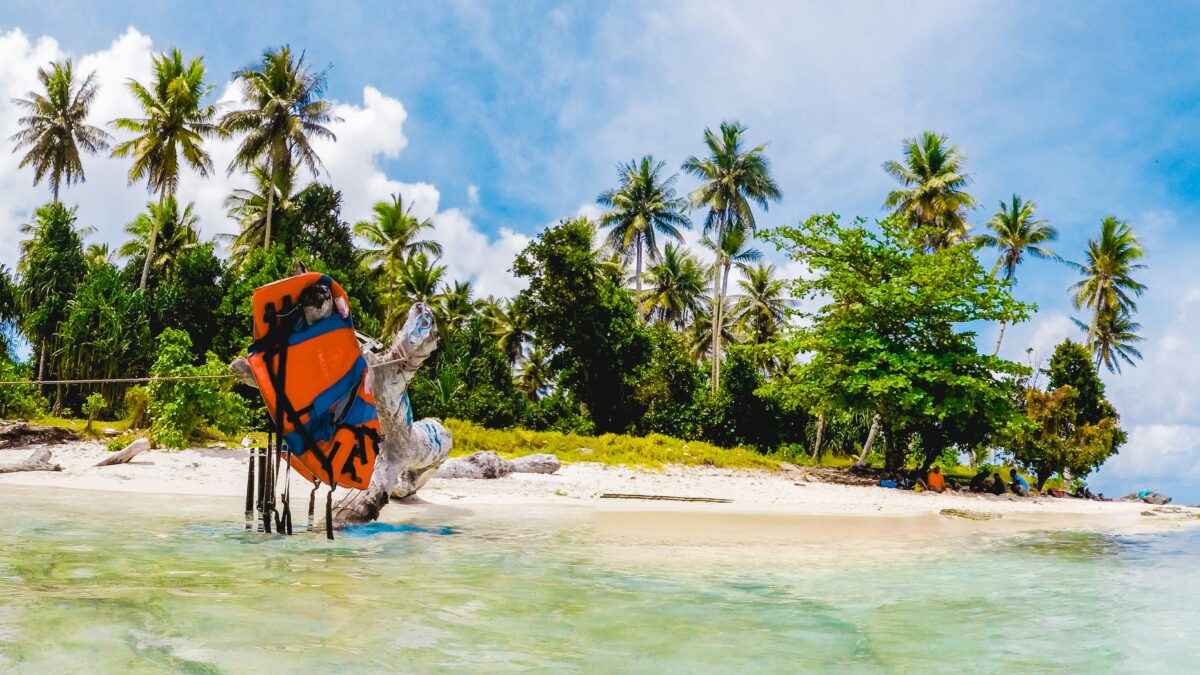 Solo traveler on a tropical island beach like Tioman