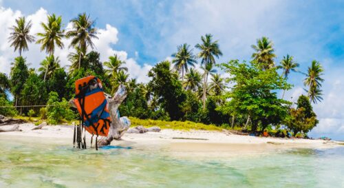Solo traveler on a tropical island beach like Tioman